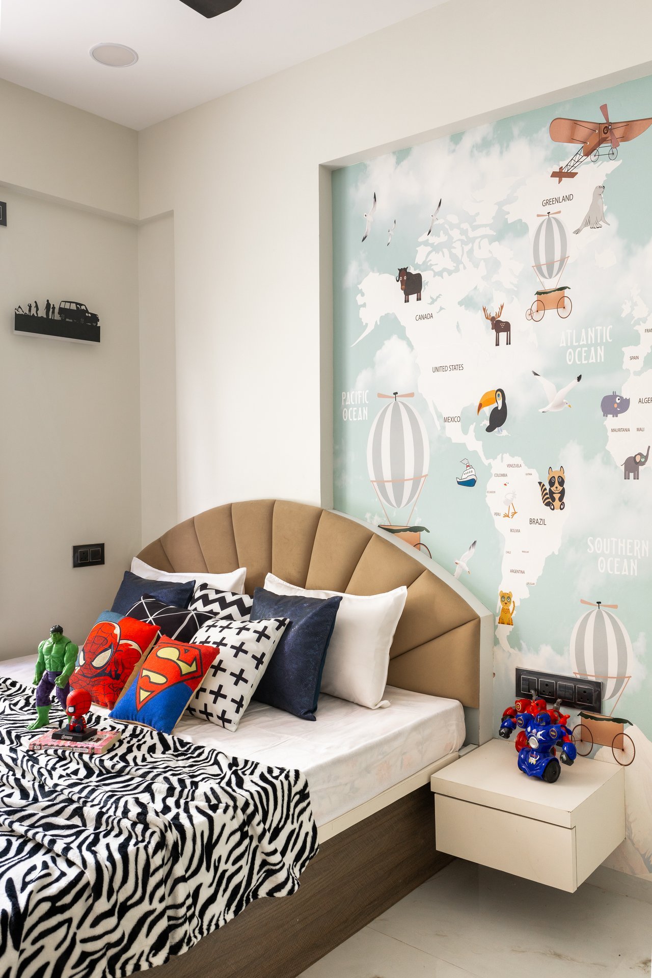 Kids bedroom with world map accent wall by Design DNA
