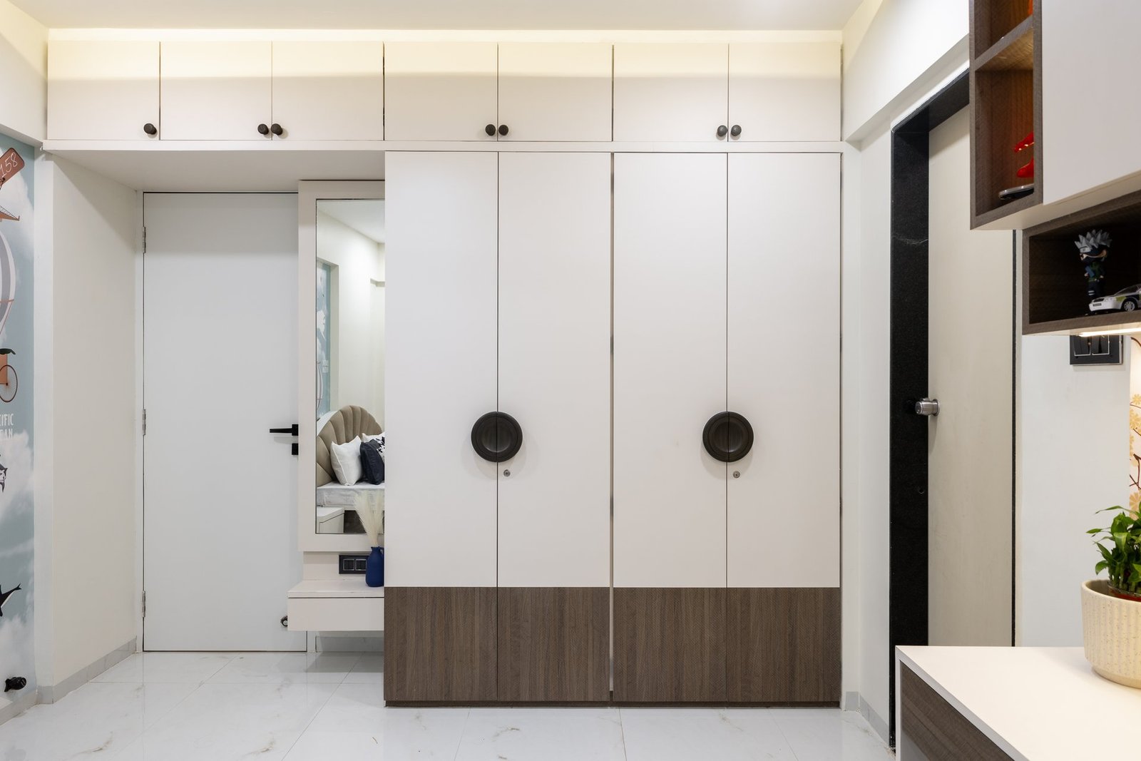 Kids room wardrobe with circular designer handles by Design DNA