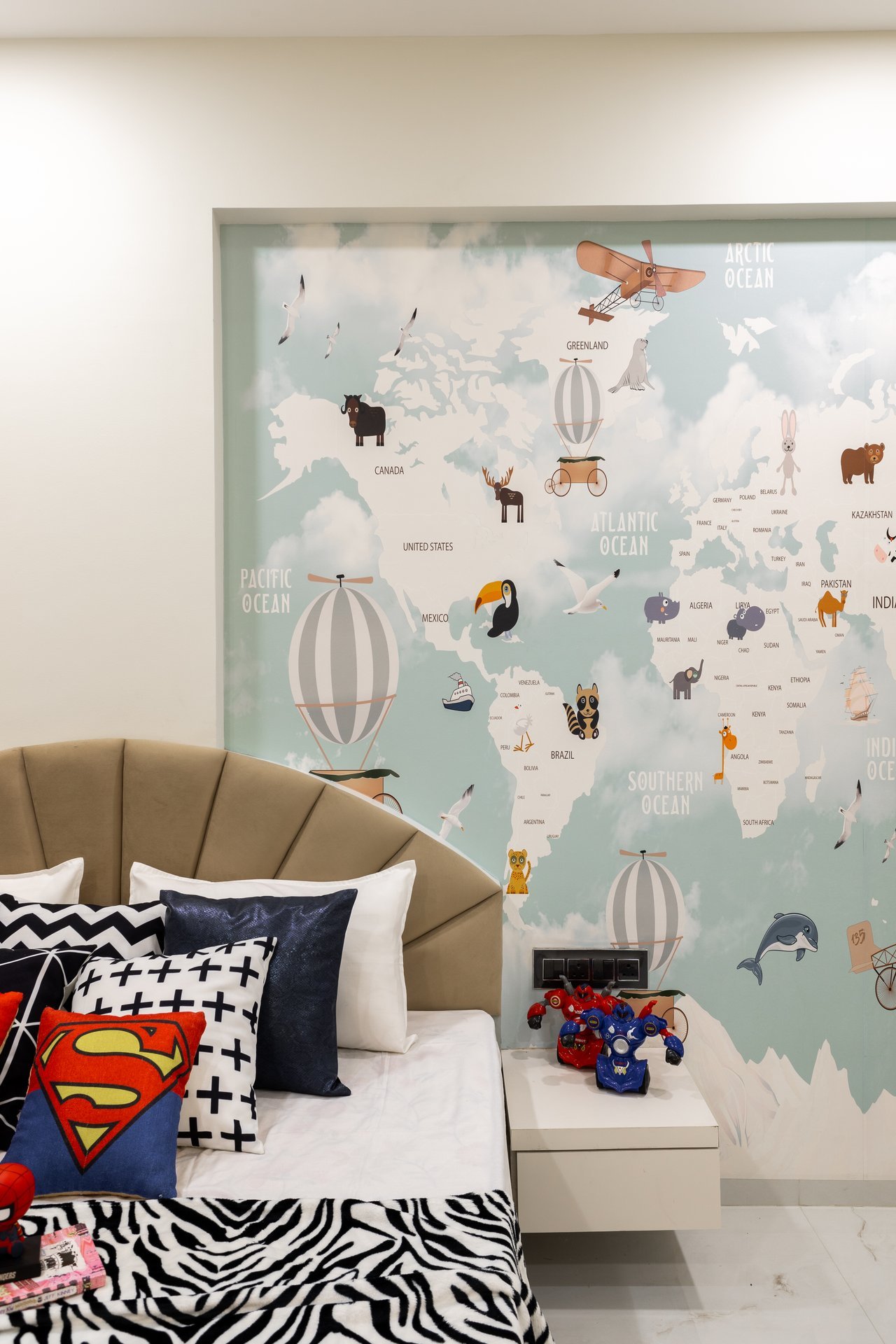 Kids bedroom world map wall and scalloped headboard by Design DNA