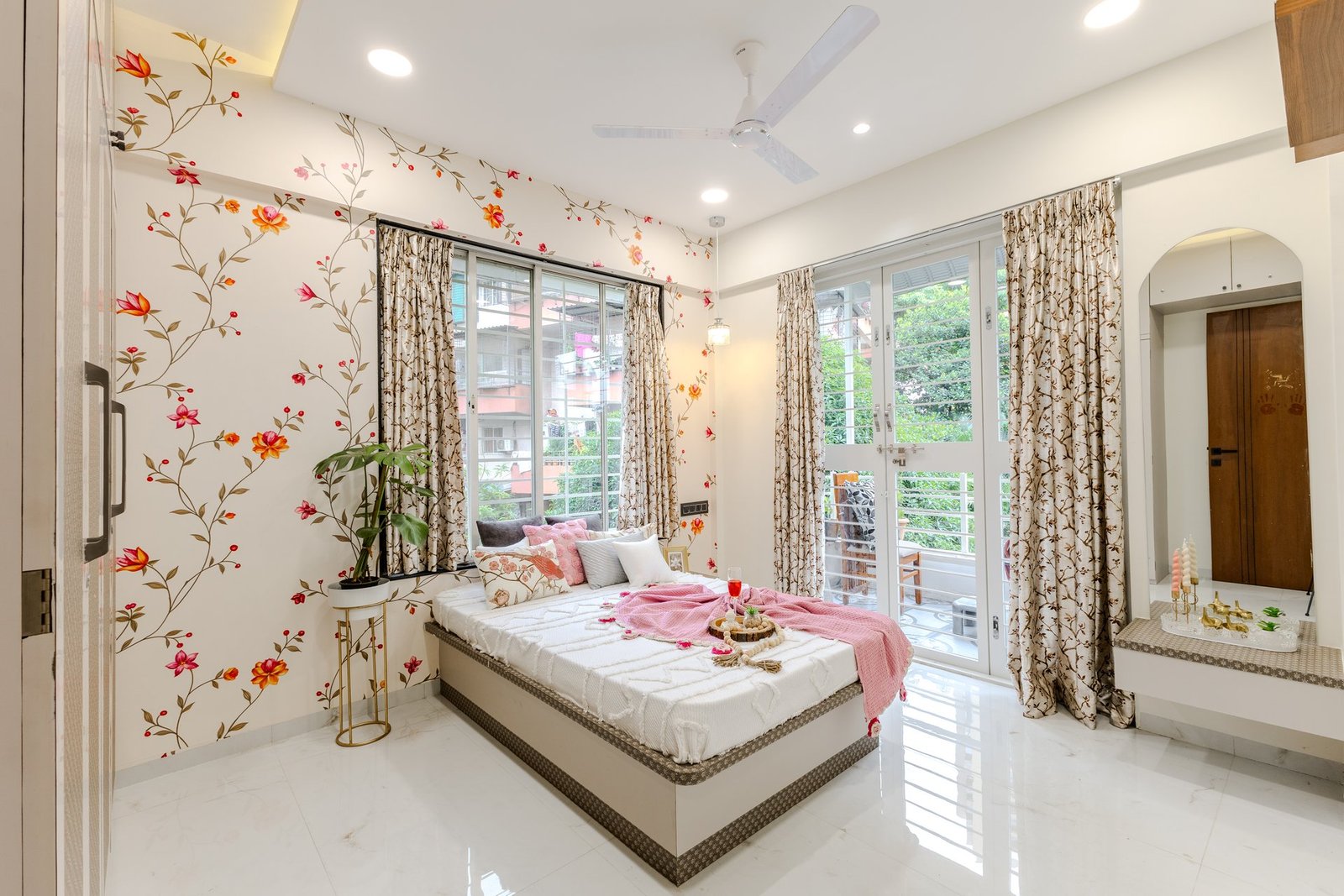 Master bedroom with balcony connection and floral mural by Design DNA