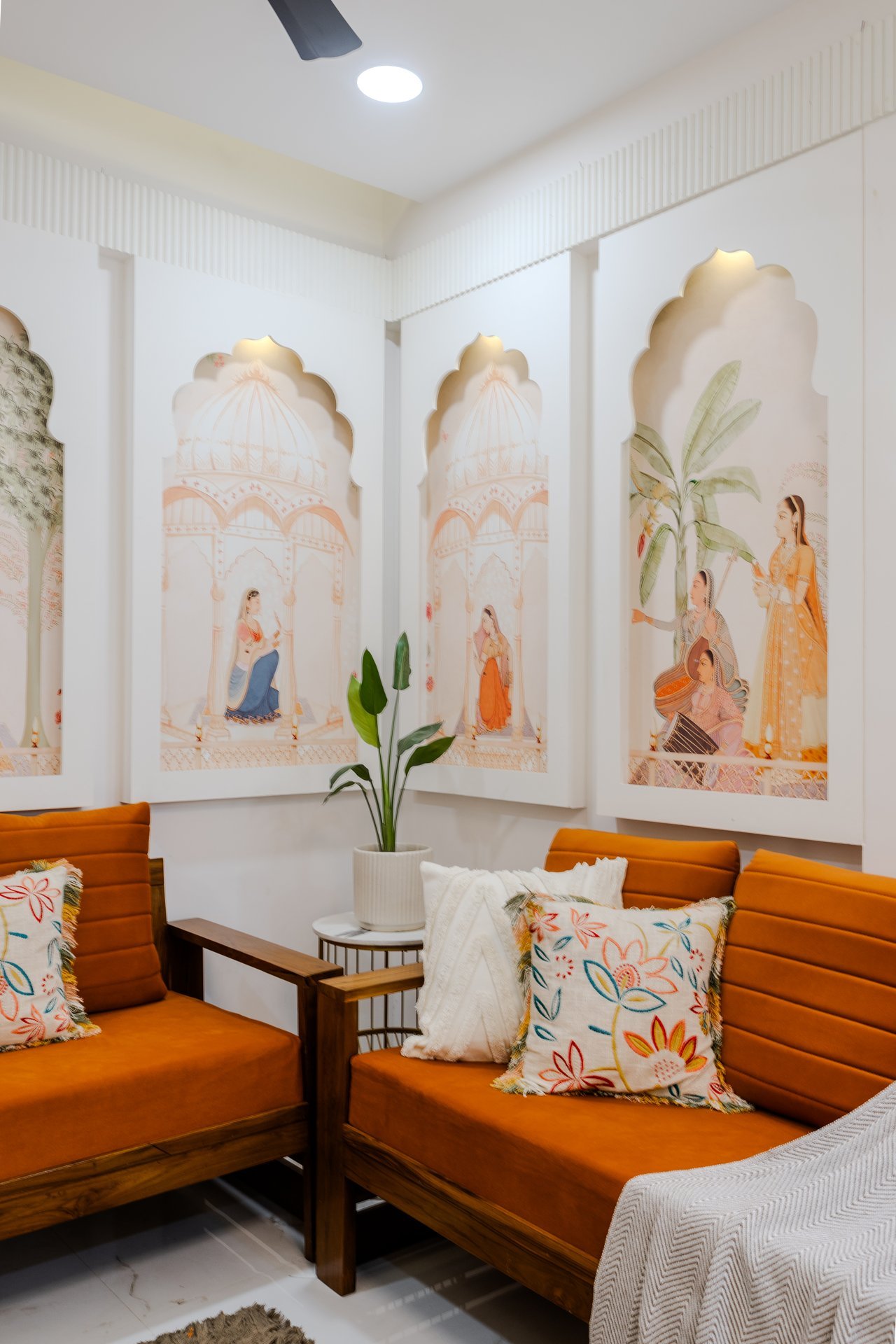 Indian heritage wall art with terracotta seating by Design DNA